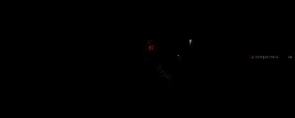 《僵尸墓地模拟器》中玩家使用武器对抗僵尸的场景