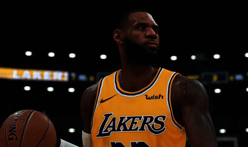 NBA与2K联合发布会现场,双方代表握手合影,背景为NBA 2K系列游戏海报