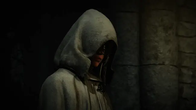 亚历克斯·嘉兰正在接受采访,背景为《艾尔登法环》游戏画面