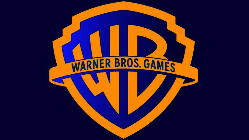 华纳兄弟游戏部门高层管理人员合影，背景为公司标志与四大IP形象展示