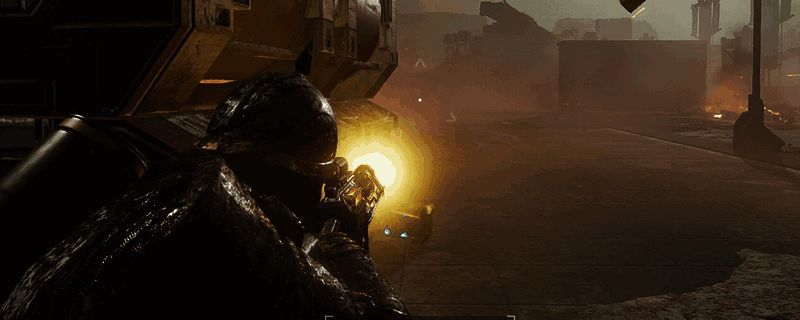 《绝地潜兵2》游戏内角色身穿中型护甲，手持主武器与手枪，周围摆放着多种战备道具