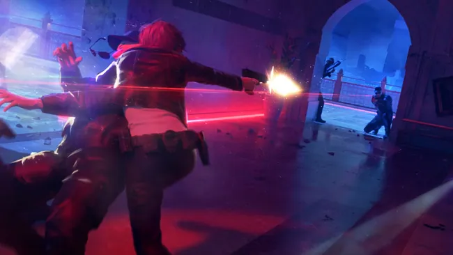 The Initiative工作室旧址外景照片：玻璃幕墙写字楼前停放着印有《完美黑暗》初代封面的复古游戏卡带造型雕塑，雕塑表面覆盖薄尘